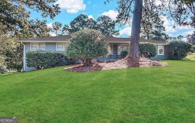 ranch-style house with a front lawn