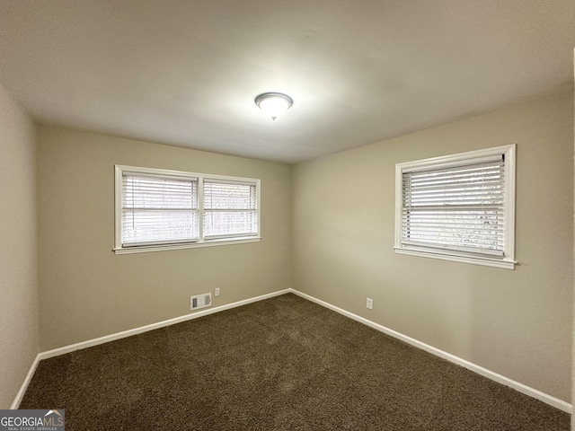 view of carpeted spare room