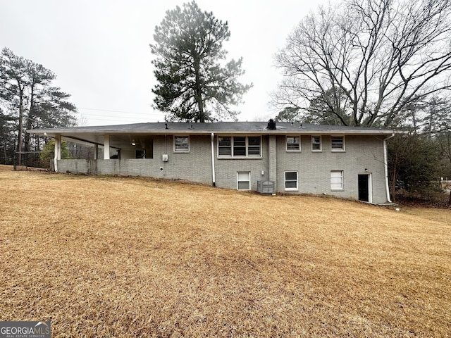 back of property with a yard