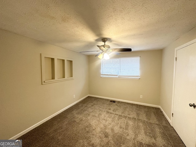 4954 Springbrook Dr, Douglasville, GA 30135 - spare room with dark carpet, ceiling fan, and a textured ceiling