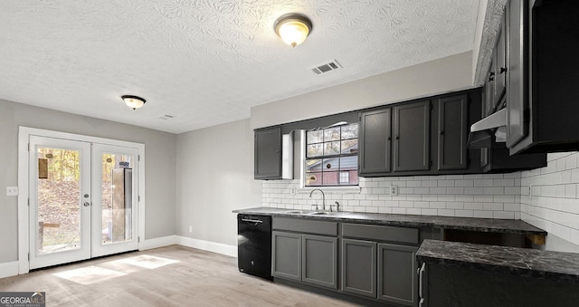 kitchen featuring french doors, sink, light hardwood / wood-style flooring, dishwasher, and backsplash