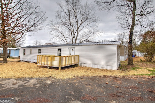 view of front of house with a wooden deck