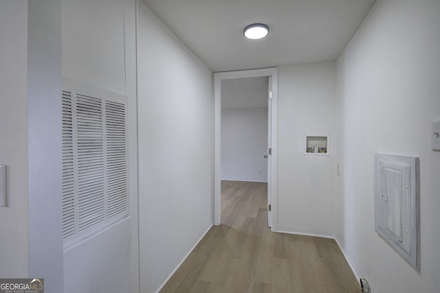 corridor with light wood-type flooring