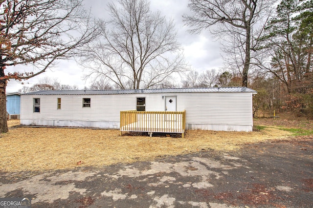 view of front of home with a wooden deck