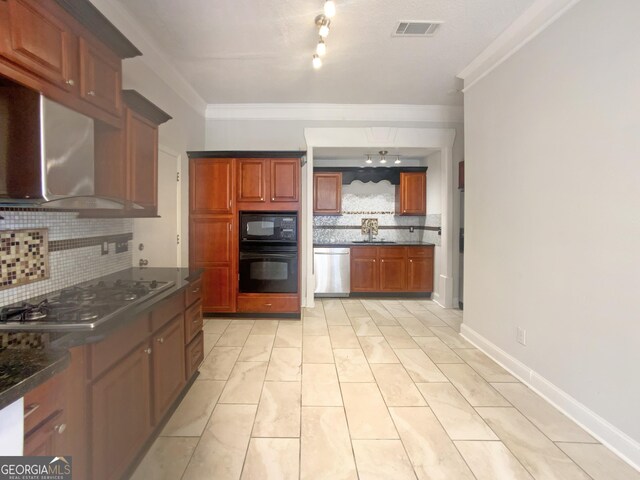 kitchen featuring crown molding, sink, wall chimney range hood, and black appliances