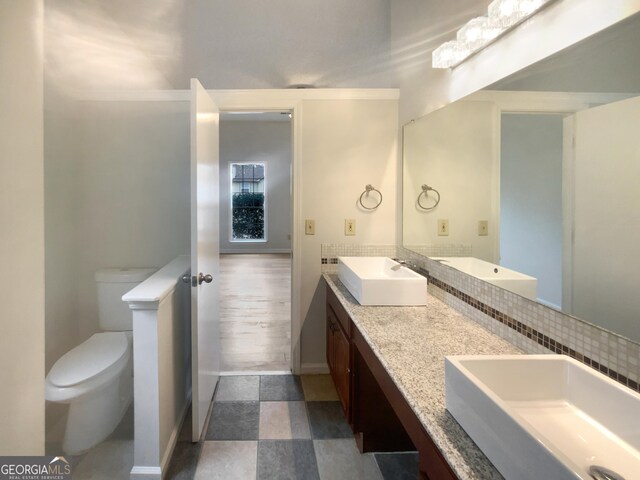 bathroom with vanity and toilet