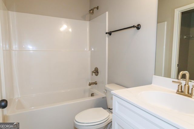 bathroom with shower / bathing tub combination, vanity, and toilet