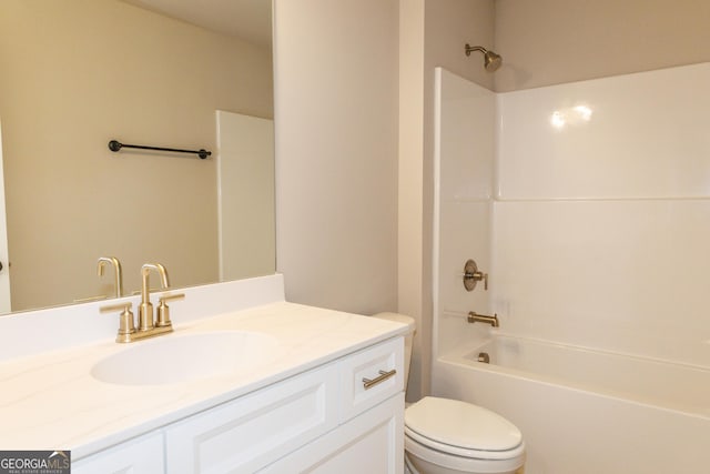 full bathroom featuring  shower combination, vanity, and toilet