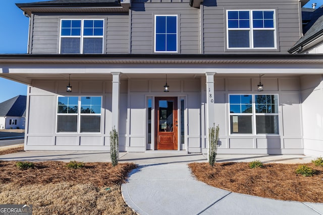 doorway to property with a porch