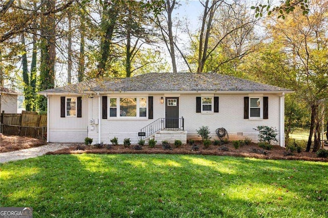 single story home featuring a front yard