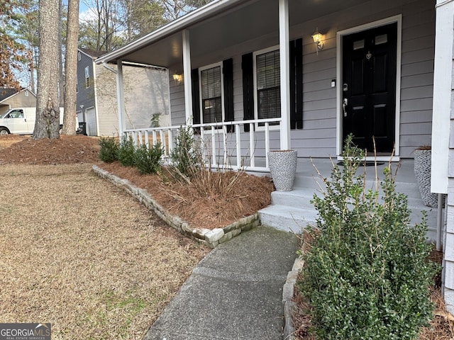 property entrance featuring covered porch