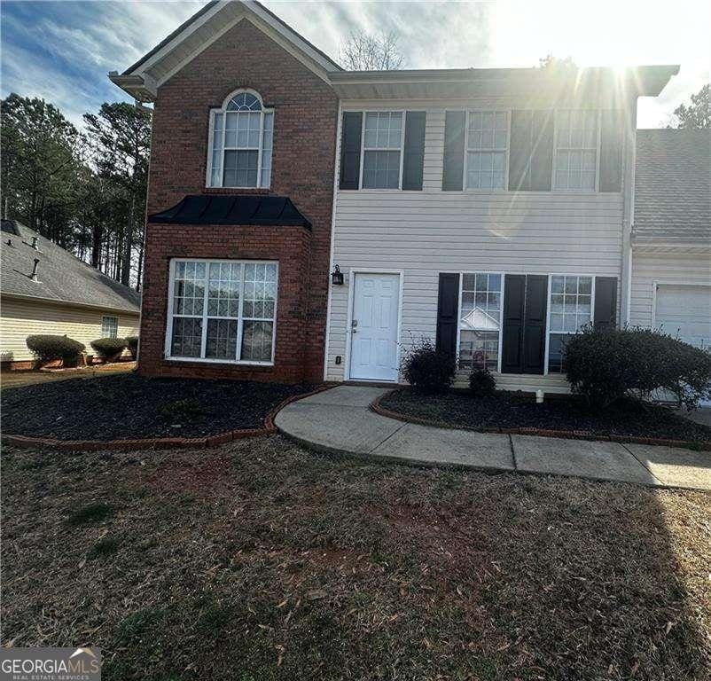 front of property with a garage