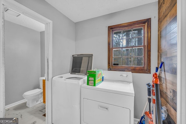 clothes washing area featuring washing machine and clothes dryer