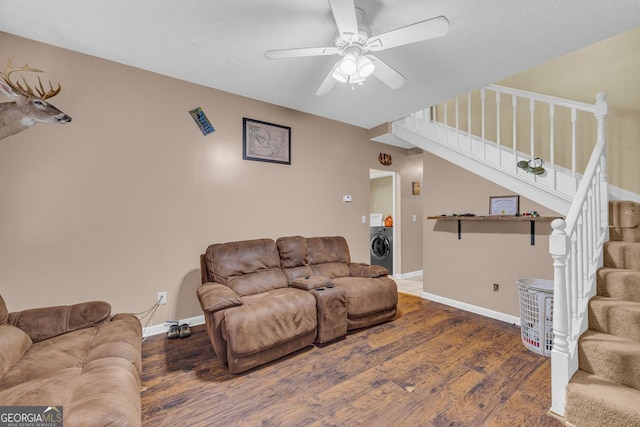 living room with ceiling fan, dark hardwood / wood-style flooring, and washer / dryer