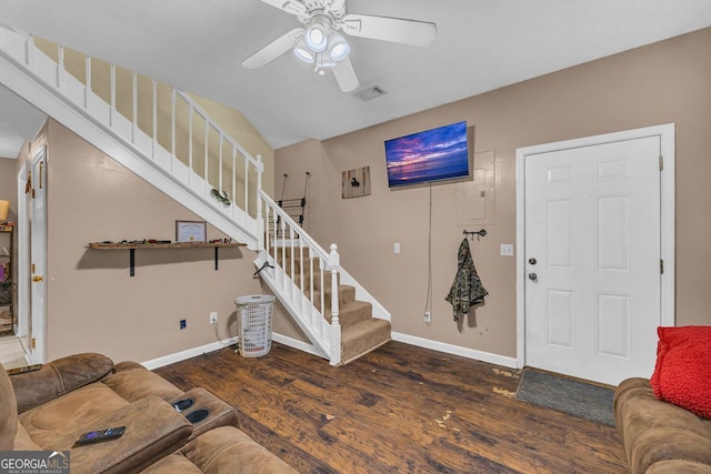 living room with ceiling fan and dark hardwood / wood-style floors