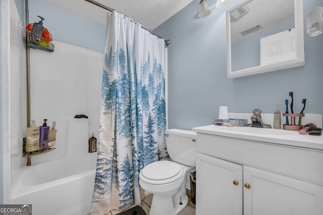 full bathroom featuring vanity, shower / tub combo with curtain, a textured ceiling, and toilet