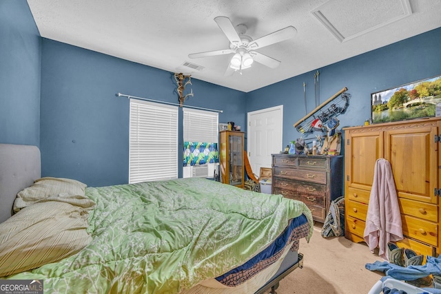 carpeted bedroom with ceiling fan