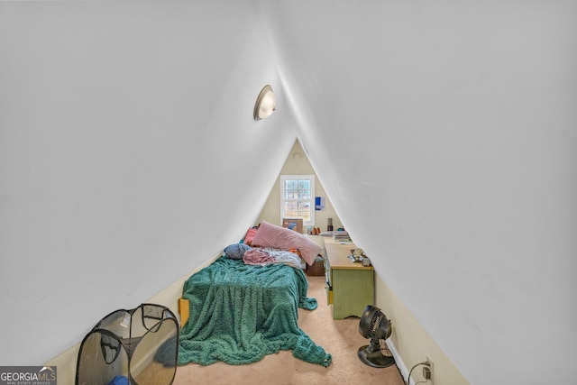 carpeted bedroom featuring vaulted ceiling