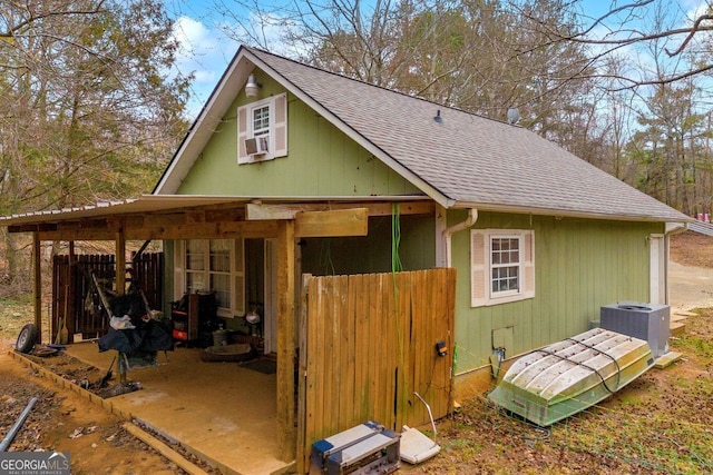 view of side of home featuring central AC and cooling unit