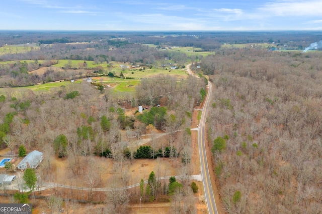 birds eye view of property with a rural view