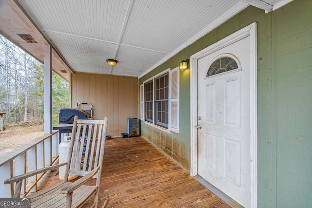 view of exterior entry featuring a porch