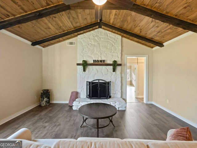 unfurnished living room with visible vents, wood ceiling, a stone fireplace, wood finished floors, and baseboards