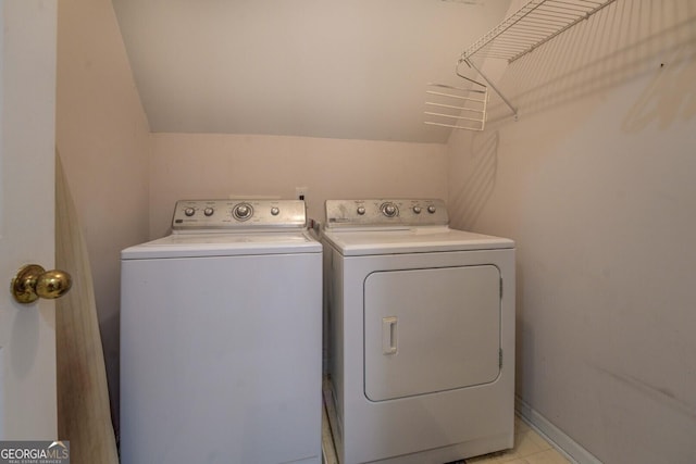 washroom featuring washing machine and dryer