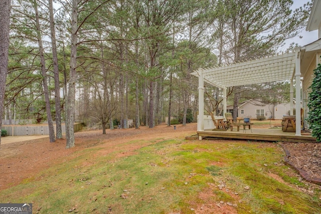 view of yard featuring a pergola and a deck