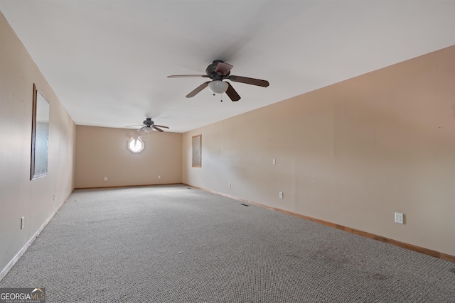 carpeted spare room with ceiling fan