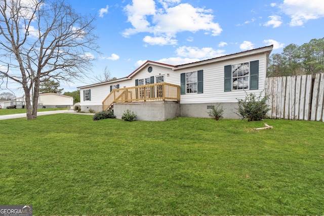 view of front of house featuring a front lawn and a deck