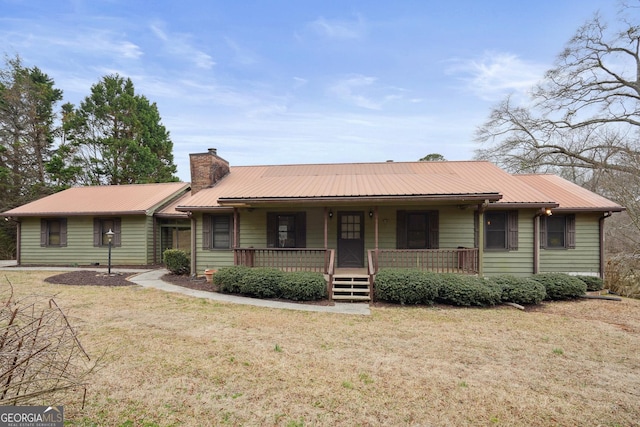 ranch-style house featuring a porch and a front yard