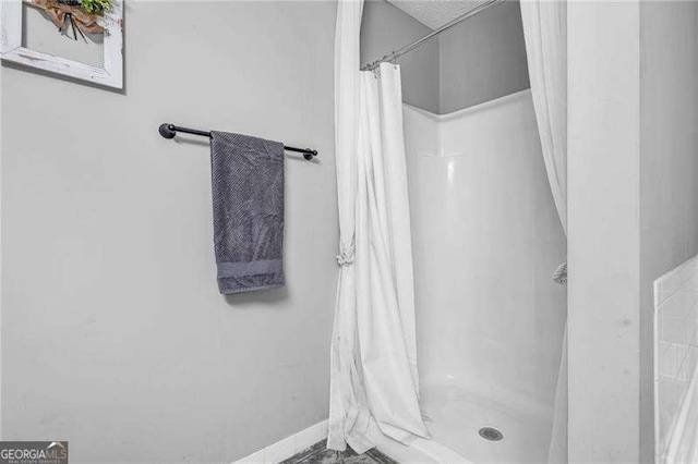 bathroom featuring curtained shower