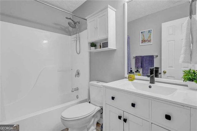 full bathroom featuring vanity, toilet, a textured ceiling, and shower / bath combination