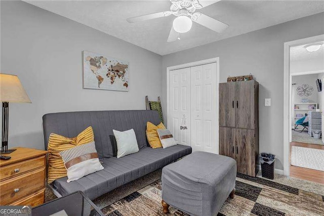 living room featuring ceiling fan