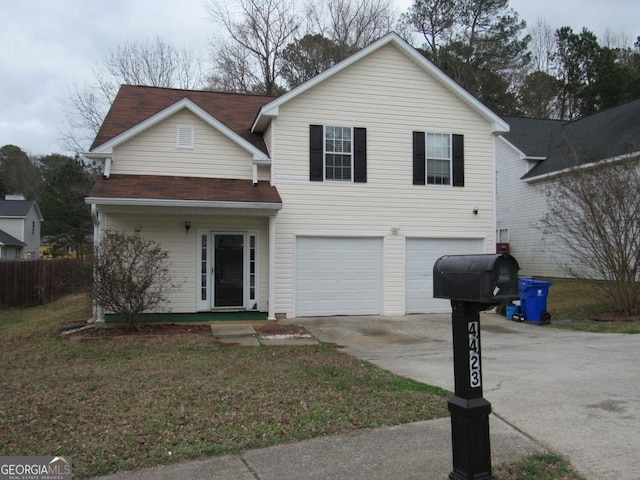 view of front of home with a garage and a front yard