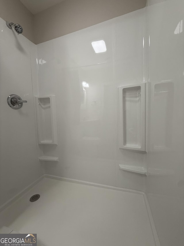 bathroom featuring walk in shower