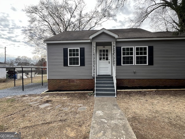 manufactured / mobile home featuring a carport