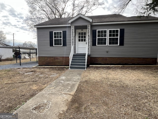 view of front of home featuring a carport