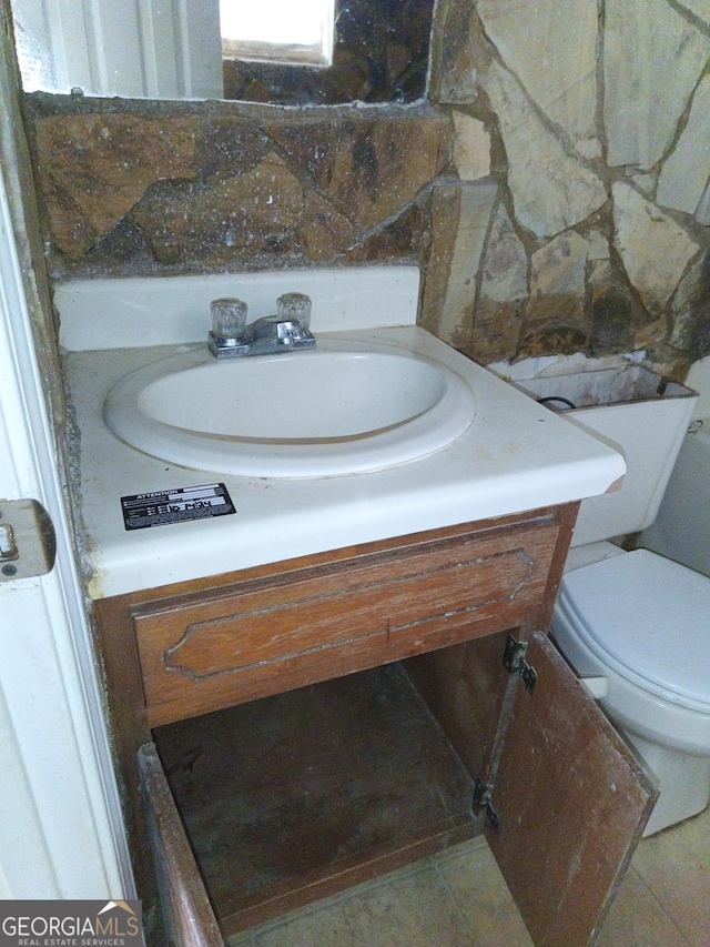 half bath with toilet and vanity