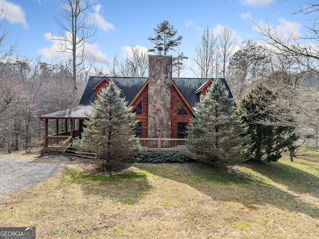 view of side of home featuring a yard