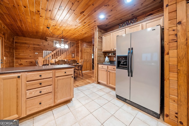 kitchen featuring light tile patterned flooring, pendant lighting, stainless steel refrigerator with ice dispenser, and light brown cabinets