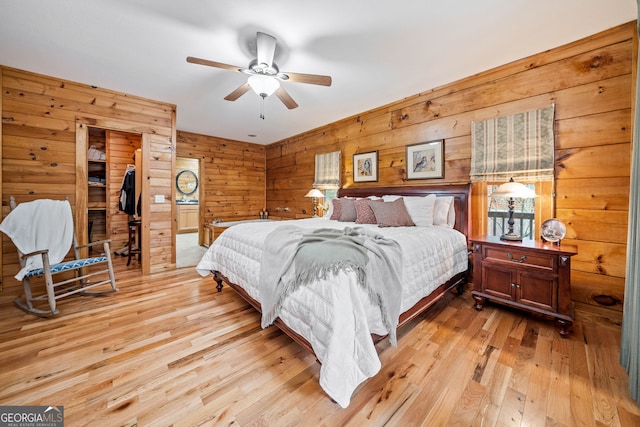 bedroom with light hardwood / wood-style floors and ceiling fan