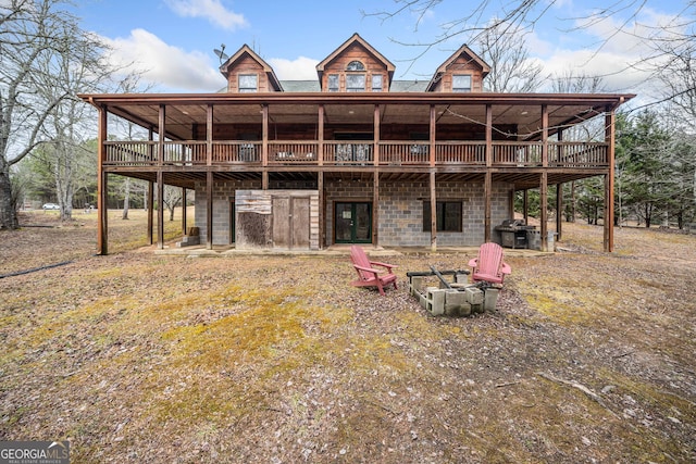 rear view of house with a wooden deck