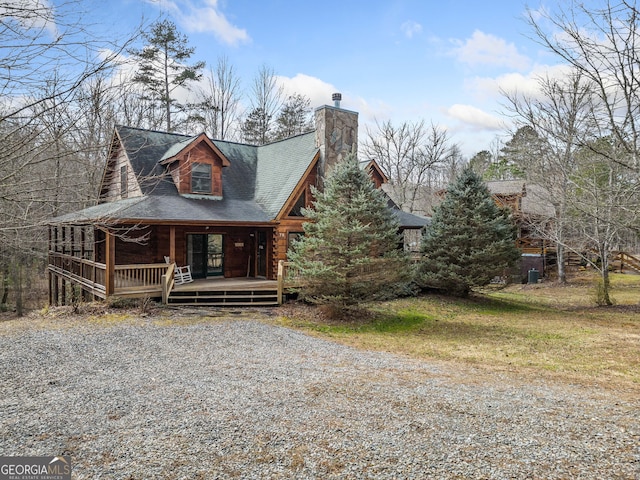 log cabin with a porch