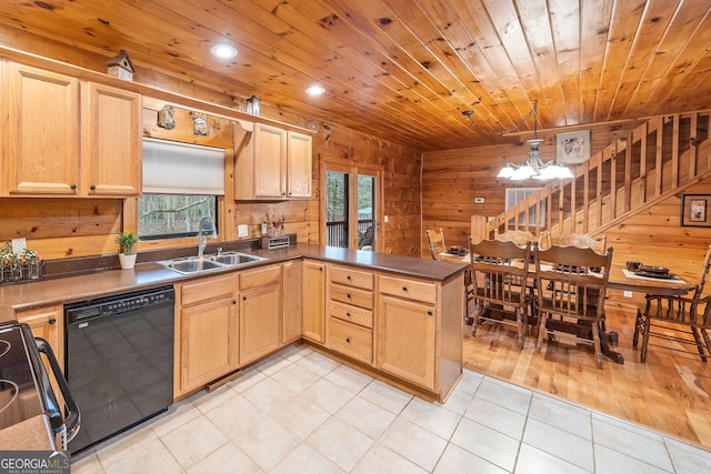 kitchen featuring sink, black dishwasher, kitchen peninsula, hanging light fixtures, and range