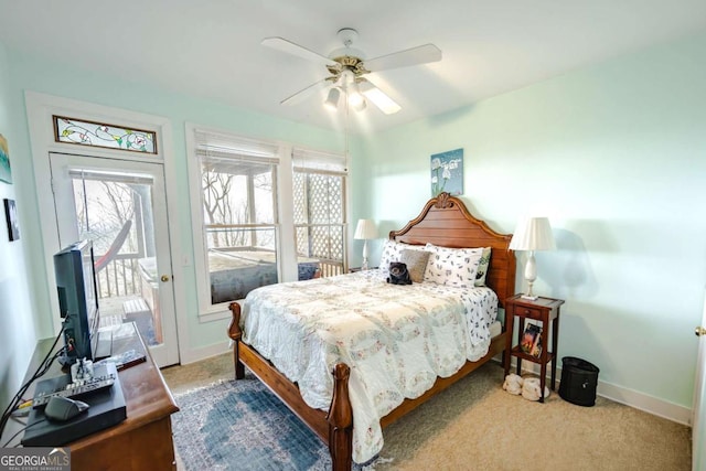 bedroom with multiple windows, light carpet, access to outside, and ceiling fan