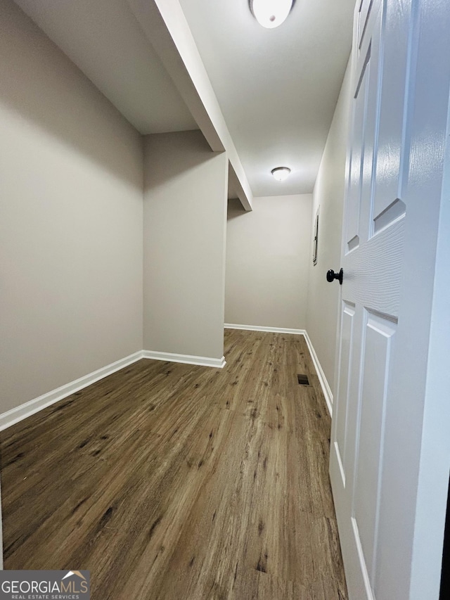 corridor with wood-type flooring