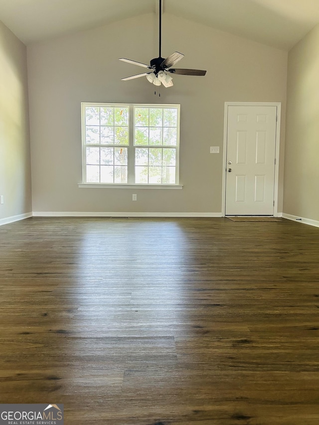 unfurnished living room with dark wood-type flooring, ceiling fan, and high vaulted ceiling