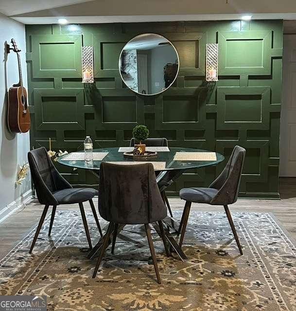 dining area with wood-type flooring