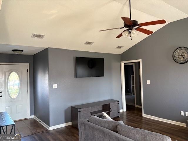 foyer with dark wood-type flooring, ceiling fan, and lofted ceiling